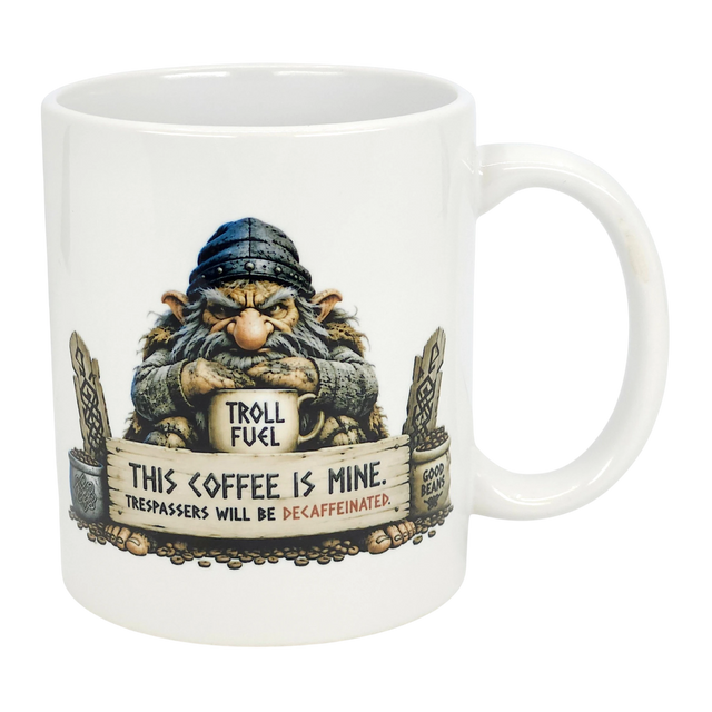 The Mug: Troll Fuel Ceramic Coffee Mug (11 oz) by Nordic Wholesale features a cartoon troll in a blue hat with a "TROLL FUEL" sign and bold warning: THIS COFFEE IS MINE. TRESPASSERS WILL BE DECAFFEINATED, plus decorative stones and Nordic folklore symbols.