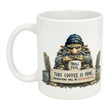 The Nordic Wholesale Mug: Troll Fuel Ceramic Coffee Mug (11 oz) features a grumpy troll with a "Troll Fuel" cup and the warning, "This coffee is mine. Trespassers will be decaffeinated," plus decorative Scandinavian borders.