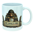 The Mug: Troll Fuel Ceramic Coffee Mug (11 oz Capacity) by Nordic Wholesale is a white ceramic mug featuring a grumpy troll inspired by Nordic folklore, holding a cup labeled "Troll Fuel" with the warning: "This coffee is mine. Trespassers will be decaffeinated." Decorative accents and coffee beans surround the troll, making this Scandinavian-themed mug both whimsical and bold.