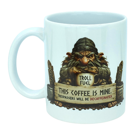 Introducing the Troll Fuel Ceramic Coffee Mug (11 oz Capacity) from Nordic Wholesale. This whimsical ceramic mug showcases a grumpy troll inspired by classic Nordic folklore, grasping a cup labeled "Troll Fuel." Accented with decorative details and coffee beans, the design features bold text: "THIS COFFEE IS MINE. TRESPASSERS WILL BE DECAFFEINATED." Perfect for adding Scandinavian charm to your coffee ritual.