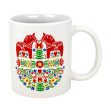 The Swedish Gift Store’s 11oz ceramic mug features two red Dala horses facing each other amid colorful Swedish folk flowers.