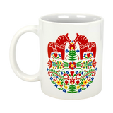 The Swedish Gift Store's 11oz ceramic mug features two red Dala Horses in a field of colorful Swedish folk flowers.