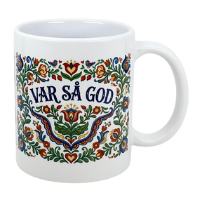 The Mug: Var Sa God Swedish Kurbits Folk Art Ceramic Mug (11 oz) by Nordic Wholesalers features colorful, traditional Swedish folk art floral designs and the phrase "Var så god" in bold blue at the center.