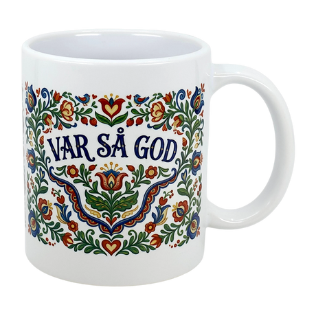 The Swedish Gift Store’s Mug: Var Sa God Swedish Kurbits Folk Art Ceramic Mug (11 oz) features vibrant Scandinavian floral patterns and bold blue "VAR SÅ GOD" text at the center.