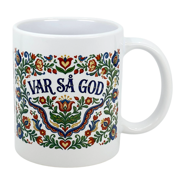 The Mug: Var Sa God Swedish Kurbits Folk Art Ceramic Mug (11 oz) by Nordic Wholesalers features colorful, traditional Swedish folk art floral designs and the phrase "Var så god" in bold blue at the center.