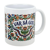 The Nordic Wholesalers 11 oz ceramic mug features colorful Swedish kurbits folk art and "Var Sa God" in the center—a cheerful, traditional cup perfect for coffee or as a Swedish-inspired gift.