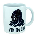 The Mug: Viking DNA White Ceramic Mug with Historically Accurate Helmet (11 oz) by Nordic Wholesale showcases a bold black graphic of a bearded Viking wearing an authentic helmet, with “VIKING DNA” in striking letters beneath the illustration. Proudly celebrate your Nordic heritage each morning with this unique Scandinavian ceramic coffee mug, perfect for adding character to your daily brew.