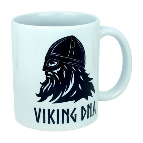 The Mug: Viking DNA White Ceramic Mug with Historically Accurate Helmet (11 oz) by Nordic Wholesale showcases a bold black graphic of a bearded Viking wearing an authentic helmet, with “VIKING DNA” in striking letters beneath the illustration. Proudly celebrate your Nordic heritage each morning with this unique Scandinavian ceramic coffee mug, perfect for adding character to your daily brew.