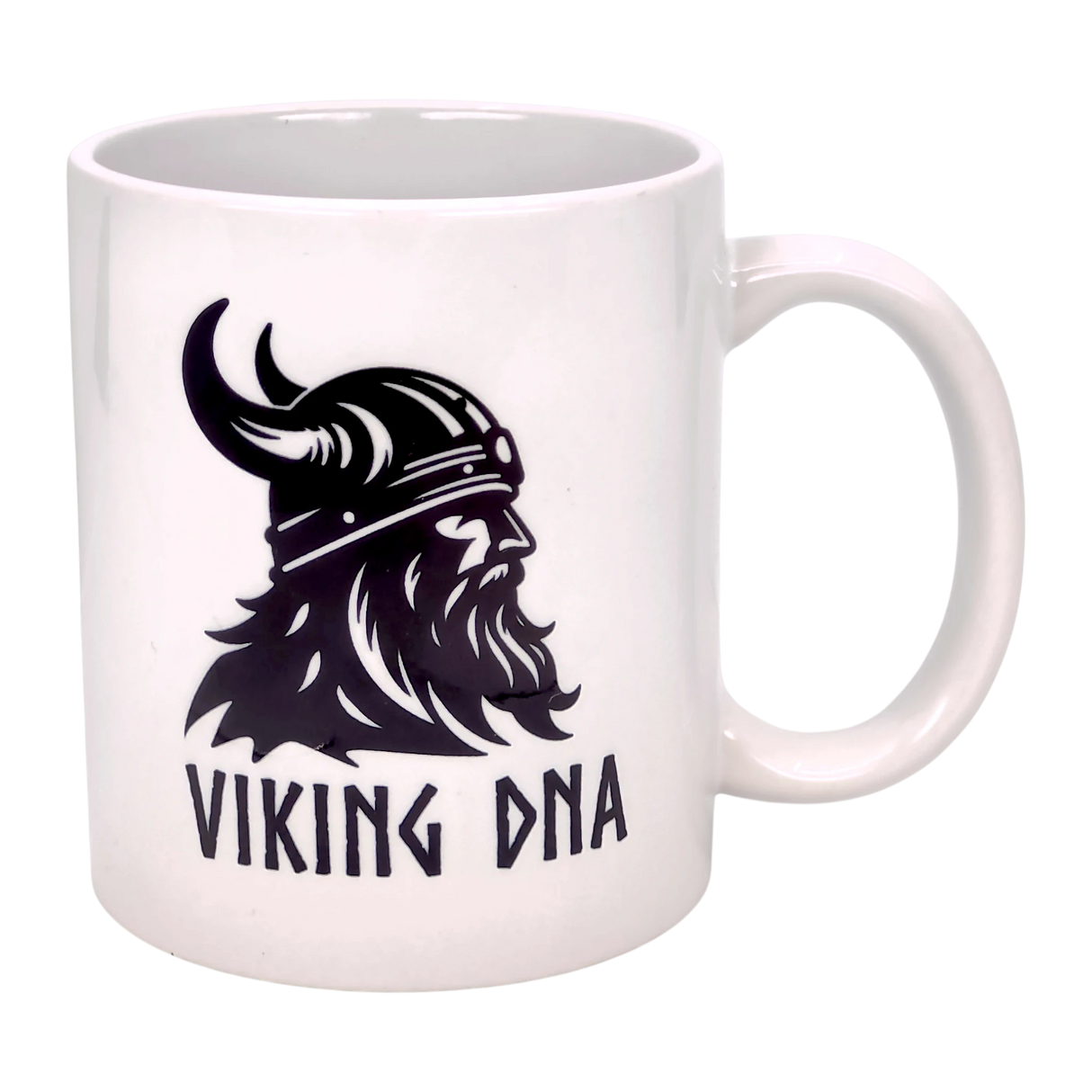 Show your Norse pride with the Swedish Gift Store’s Mug: Viking DNA White Ceramic Mug (11 oz), featuring a striking black Viking helmet and beard graphic with "VIKING DNA" text—ideal for fans of Scandinavian heritage.