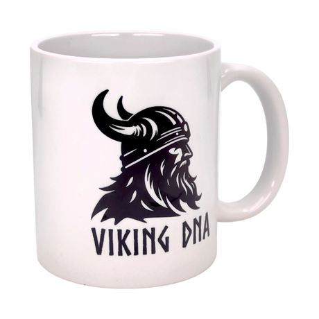 The Mug: Viking DNA White Ceramic Mug (11 oz) by Nordic Wholesale features a black Viking with a horned helmet and bold VIKING DNA text—ideal for anyone celebrating their Norse heritage.