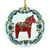 Round ceramic ornament featuring a red Swedish Dala horse with a blue and green floral rosemaling border.