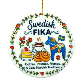 Round ceramic ornament featuring Swedish FIKA text, illustrations of coffee, cake, cinnamon buns, flowers, a Dala horse, and a Swedish flag.