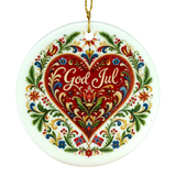 Ceramic Nordic ornament with a red heart, floral accents, “God Jul” at the center, and two small Norwegian flags below in traditional folk art style.
