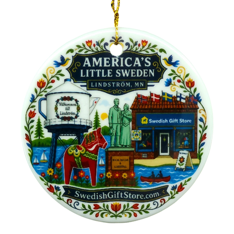 Round ornament featuring a water tower, Dala horse, store, and floral patterns. “SwedishGiftStore.com” is printed on the design.