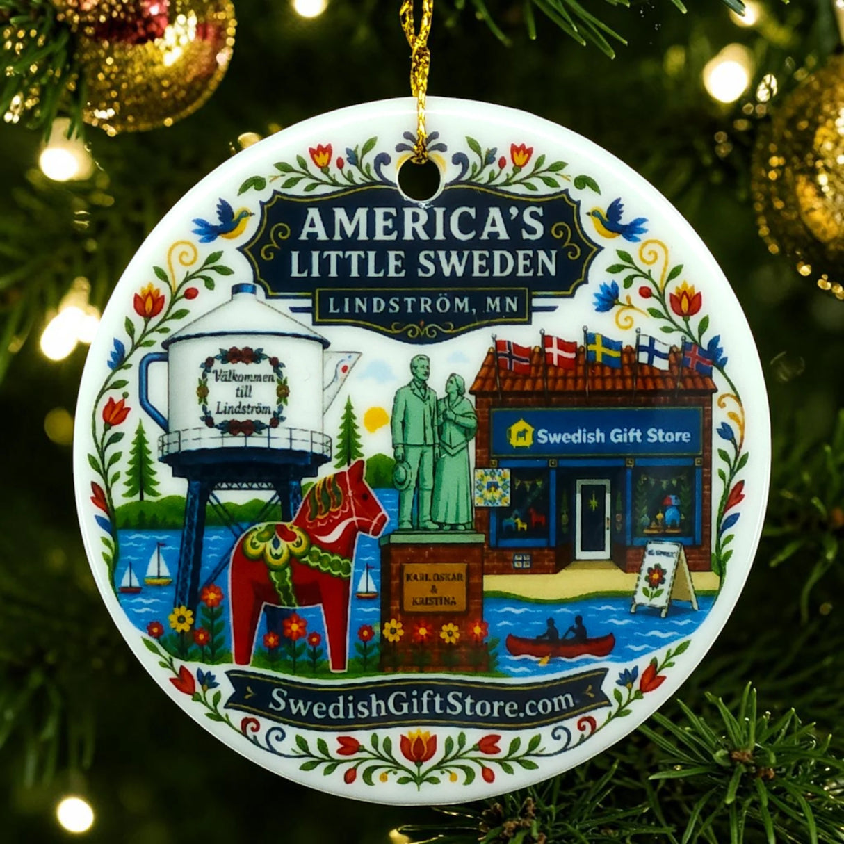 Round ornament featuring illustrations of Lindström landmarks, including a water tower, Swedish store, statue, dala horse, and greenery.