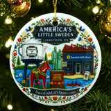 Round ornament featuring illustrations of Lindström landmarks, including a water tower, Swedish store, statue, dala horse, and greenery.