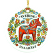 Round ornament showing a red Dala horse with colorful floral designs, the word SVERIGE above and DALAHÄST below.