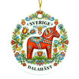 Round ornament showing a red Dala horse with colorful floral designs, the word SVERIGE above and DALAHÄST below.