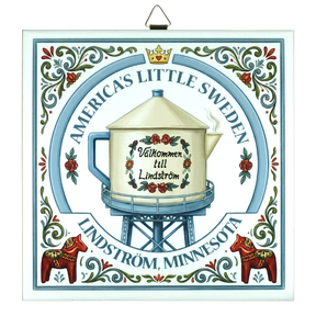 Decorative sign with Lindstrom teapot water tower, Swedish folk art patterns, floral motifs, Dala horses, and text: Americas Little Sweden, Välkommen till Lindström.