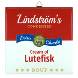 Ceramic wall tile styled like a red and white soup can label; text reads Lindströms Condensed Extra Chunky Cream of Lutefisk Soup, with a gold medal and three fish.