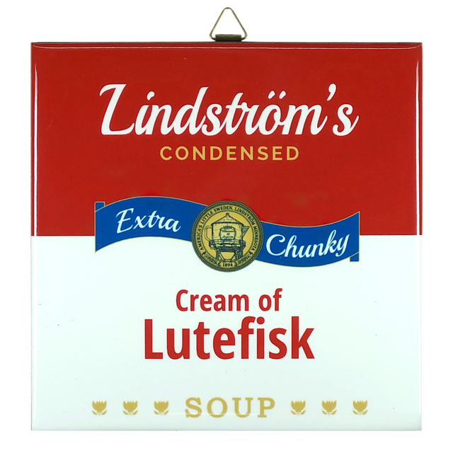 Ceramic wall tile styled like a red and white soup can label; text reads Lindströms Condensed Extra Chunky Cream of Lutefisk Soup, with a gold medal and three fish.