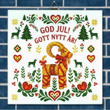 Sign with a straw Swedish Julbock, red hearts, green trees, and floral designs. Text in Swedish reads “God Jul! Gott Nytt År!” on a light background.