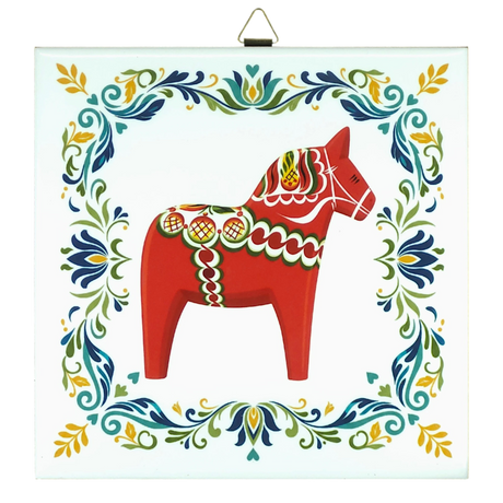 Square ceramic tile featuring a red Swedish Dala horse with colorful accents, centered and bordered by ornate Nordic floral patterns.