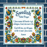 Decorative sign on blue tiles with the Swedish Table Prayer, colorful florals, hearts, flags, and kurbits motifs in a Scandinavian style.