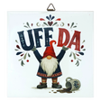 Square Scandinavian wall plaque featuring a ceramic tomte gnome in a red cap, the text UFF DA above a spilled mug, and folk-art patterns.