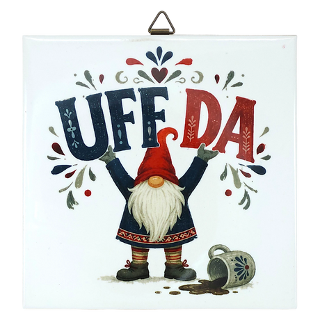 Square Scandinavian wall plaque featuring a ceramic tomte gnome in a red cap, the text UFF DA above a spilled mug, and folk-art patterns.