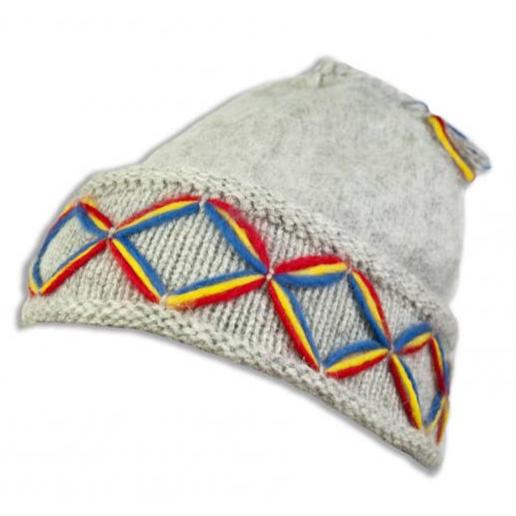 The Borjesson Lovikka Knit Hat in light grey is a stylish knit beanie made from Shetland wool, adorned with multicolored geometric Nordic pattern embroidery on the brim.