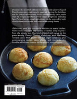 The book Aebleskiver by Pim Pauline Overgaard showcases new ways to make traditional Danish pancakes—golden, round treats perfect for any occasion and a versatile addition to every cookbook collection.
