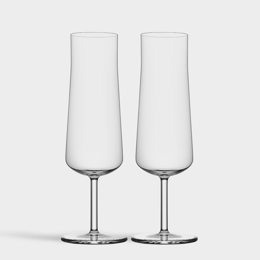 The Orrefors: Informal Champagne Glass (2-Pack) showcases two elegant flutes with slender stems against a plain backdrop, embodying Scandinavian design.