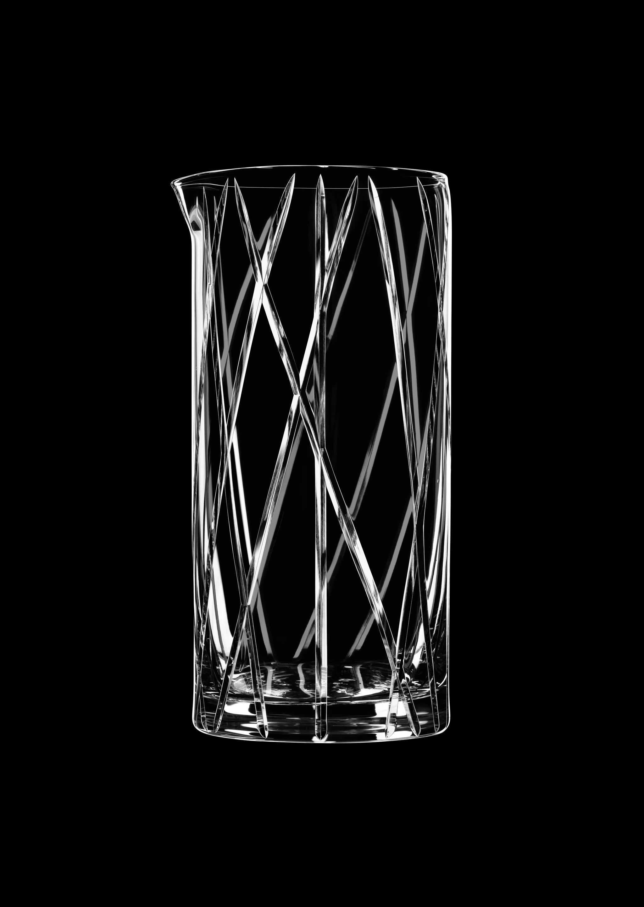 The Orrefors: City Mixing Glass with Spoon 22oz features a zigzag etched pattern and is displayed against a black background.