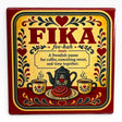 Metal sign with “FIKA” and Swedish coffee break definition, featuring hearts, flowers, coffee cups, teapot, and pastry in red, yellow, and black Scandinavian-style design.