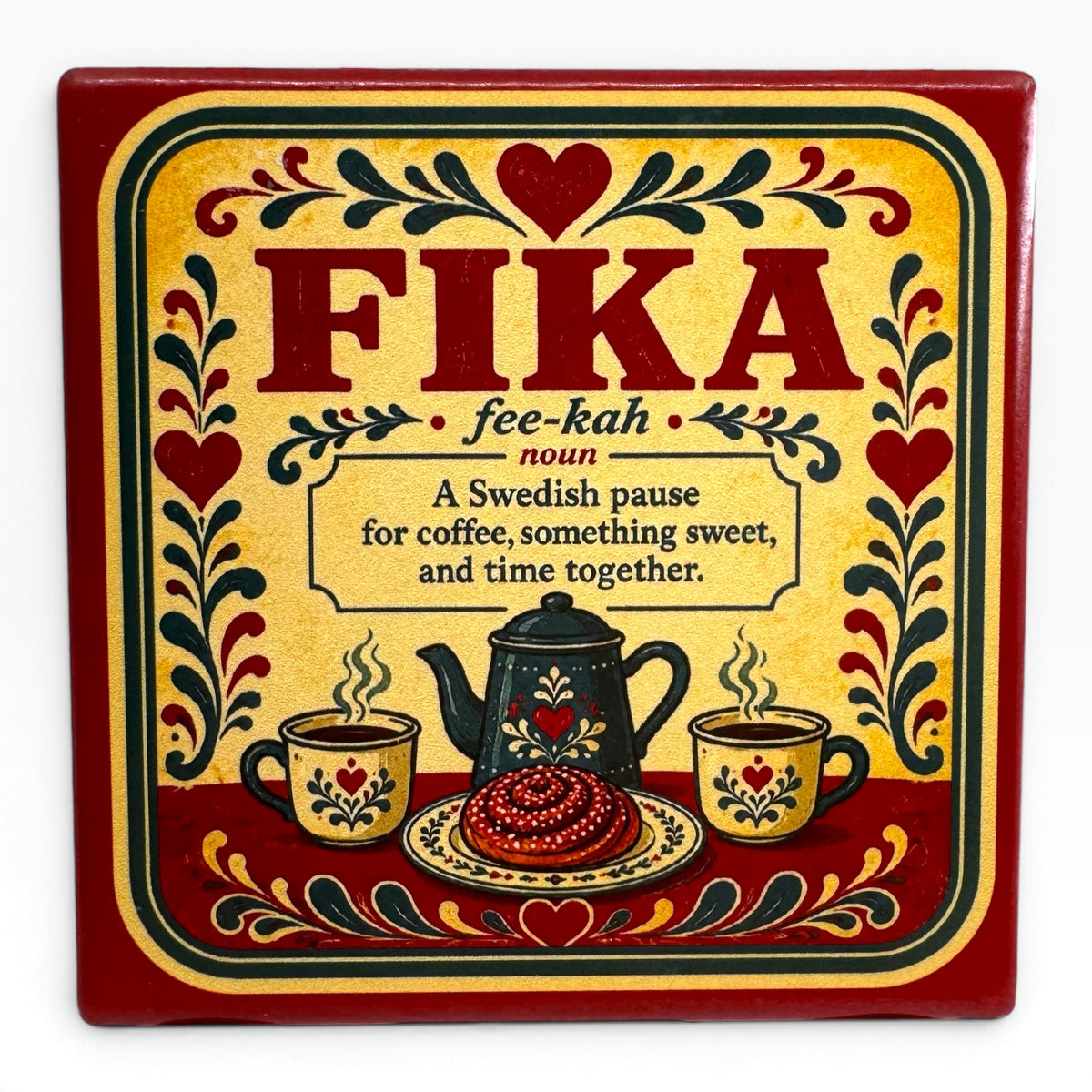 Metal sign with “FIKA” and Swedish coffee break definition, featuring hearts, flowers, coffee cups, teapot, and pastry in red, yellow, and black Scandinavian-style design.