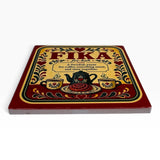 Decorative sign featuring two coffee cups and the text: “Fika: A Swedish pause for coffee, something sweet, and time together.”.