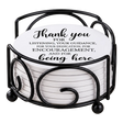 Round white drink coasters stacked in a black metal holder; the top coaster reads, “Thank you for listening, your guidance, and encouragement.”.