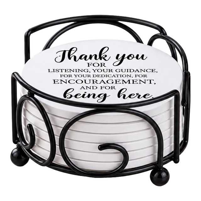 Round white drink coasters stacked in a black metal holder; the top coaster reads, “Thank you for listening, your guidance, and encouragement.”.
