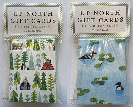 Two packs of Up North Gift Cards by Kirsten Sevig, 10 cards each: one with loons and cabins among trees, the other with loons swimming among lily pads.