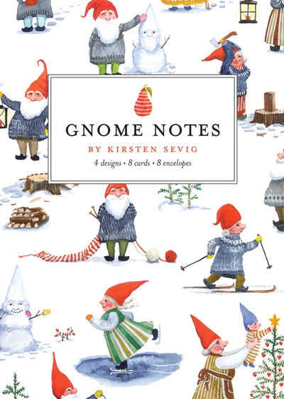 The Card Pack: Gnome Notes boasts an illustrated cover by Kirsten Sevig, showcasing gnomes participating in winter activities such as skiing and building snowmen, all created using a watercolor set. These delightful notes are printed on recycled paper.