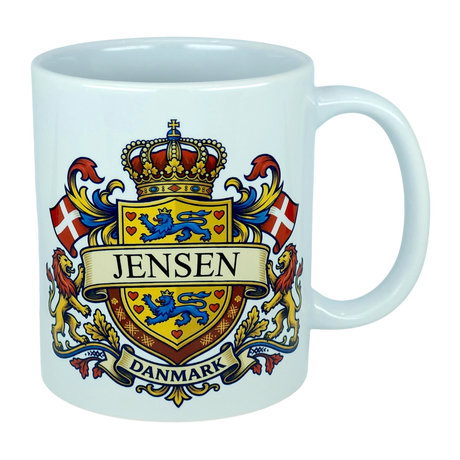 Elevate your drinkware with the Nordic Wholesale Mug: Denmark Coat of Arms Custom Name Ceramic Mug (11 oz Capacity)—a white ceramic heritage mug showcasing a vibrant Danish family crest with the Jensen name, blue lions, red Danish flags, a crowned shield, and "Danmark" below—ideal as a personalized Denmark mug.