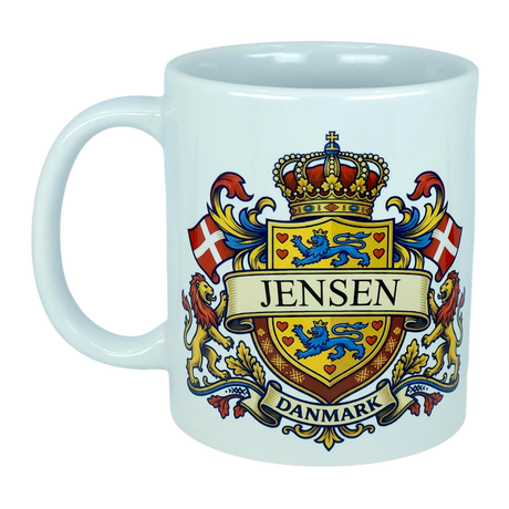 Enjoy your favorite beverages in the Mug: Denmark Coat of Arms Custom Name Ceramic Mug (11 oz Capacity) from Nordic Wholesale. This white ceramic mug showcases a vibrant Danish coat of arms design featuring lions, flags, a crown, and bold "Jensen" and "Danmark" lettering—perfectly blending tradition and style for any Danish heritage enthusiast.