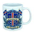 Introducing the Mug: Iceland Coat of Arms Custom Name Ceramic Mug (11 oz Capacity) by Nordic Wholesale—a white ceramic mug featuring a vibrant blue and red Icelandic crest, the custom name “Jónsson” boldly across the center, “Ísland” below, two Icelandic flags, and detailed Landvættir-inspired heraldic symbols including a griffin and a dragon—perfect as a personalized gift to celebrate your Icelandic heritage.