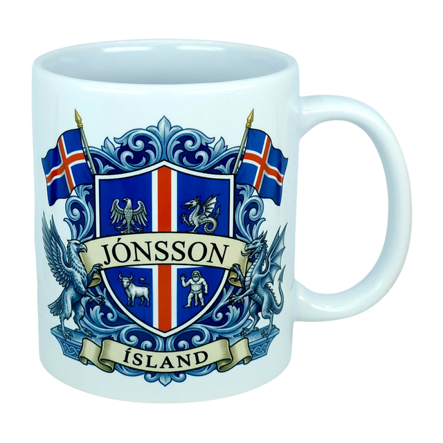 Introducing the Mug: Iceland Coat of Arms Custom Name Ceramic Mug (11 oz Capacity) by Nordic Wholesale—a white ceramic mug featuring a vibrant blue and red Icelandic crest, the custom name “Jónsson” boldly across the center, “Ísland” below, two Icelandic flags, and detailed Landvættir-inspired heraldic symbols including a griffin and a dragon—perfect as a personalized gift to celebrate your Icelandic heritage.