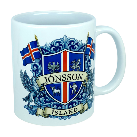 Experience the unique heritage of Iceland with the Mug: Iceland Coat of Arms Custom Name Ceramic Mug (11 oz Capacity) by Nordic Wholesale—a white ceramic mug featuring a striking blue and red Icelandic crest labeled Jönsson Ísland, flanked by Icelandic flags and mythical creatures on a crisp white background, making it an ideal Landvættir-inspired gift for lovers of Icelandic tradition.