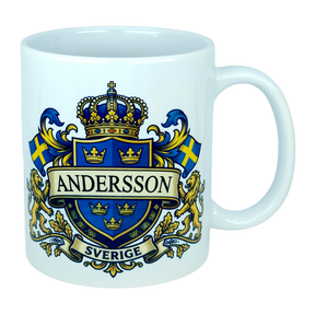 Celebrate your heritage with the Mug: Sweden Coat of Arms Custom Name Ceramic Mug (11 oz Capacity) from Nordic Wholesale—a white ceramic mug featuring a bold blue and gold Swedish coat of arms design, two Swedish flags, gold lions, your custom name (e.g. ANDERSSON) in prominent letters, and "SVERIGE" on a banner below the crest; this unique and personalized Sweden mug is perfect for showcasing national pride.