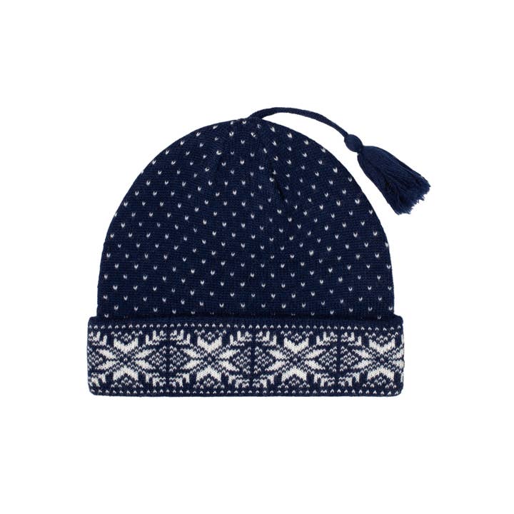 Navy and white Snowflake Norwegian wool hat featuring a geometric pattern and tassel.