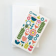The Juniper Blue "Tuli" Gift Card set includes 8 Scandinavian folk-art gift tags featuring fox and colorful floral designs, each sized 2"x3.5", with envelopes, perfect for any occasion.