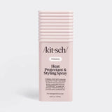 A pink spray bottle with a black pump, labeled “Kitsch,” standing upright on a plain white background.